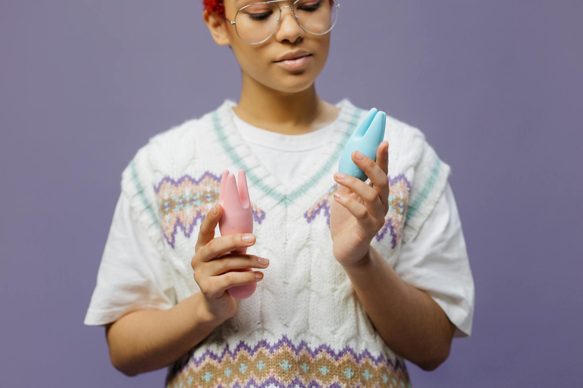 Woman in her forties holding a lemon clitoral vibrator, expressing confidence and discovery